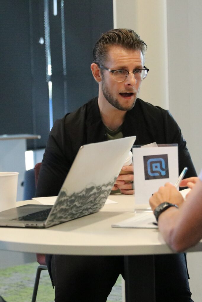 Professional collaborating with colleagues in a modern office setting